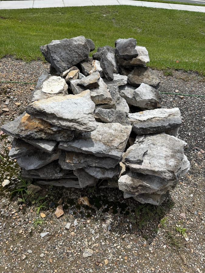 Pile of gray fieldstone boulders at the West Volusia Shed Co. yard in DeLand